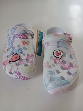 Kids White Butterfly Clogs with Pastel Accents and Charm.